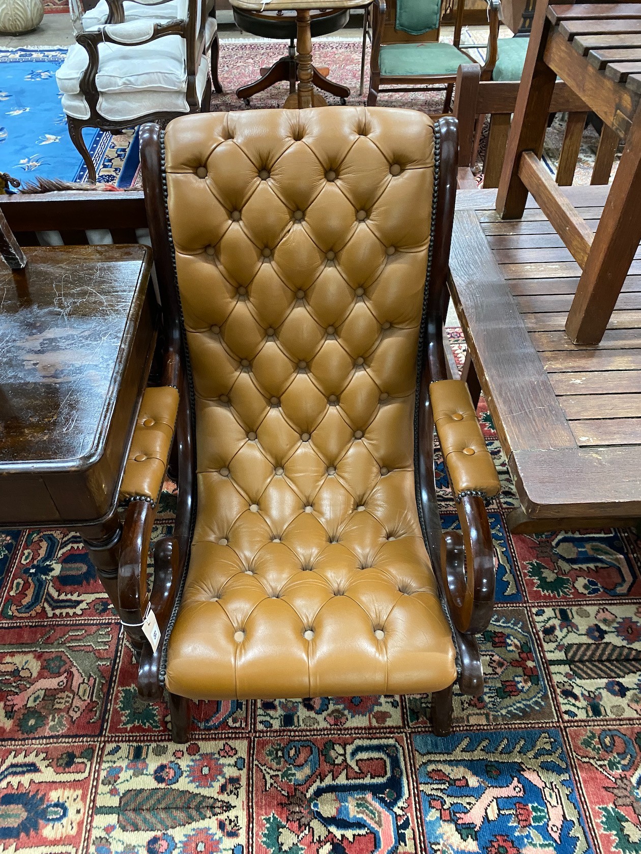 A Victorian style buttoned leather mahogany open armchair, width 63cm, depth 75cm, height 96cm